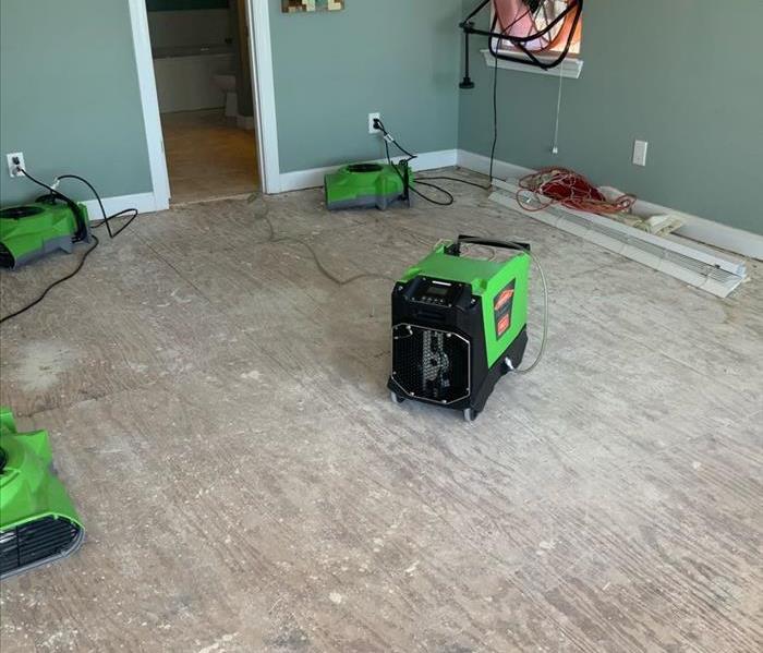 water damage in a residential home. air movers are in action. 